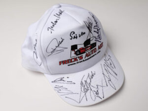 Freck’s Auto Art Cap Signed by Penske, Moss, Montoya, Fittipaldi + 7 more - View 2