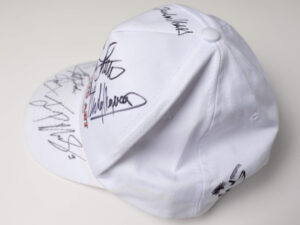 Freck’s Auto Art Cap Signed by Penske, Moss, Montoya, Fittipaldi + 7 more - View 3
