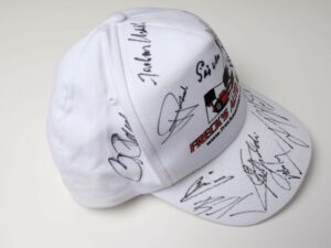 Freck’s Auto Art Cap Signed by Penske, Moss, Montoya, Fittipaldi + 7 more - View 5
